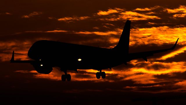 Embraer ERJ-190 — - Arriving during the autumn sun set