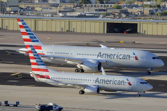 Boeing 737-800 (N827NN) - American Boeing 737-823 N827NN taxis past American Boeing 787-823 N801AC at Phoenix Sky Harbor on March 10, 2015.