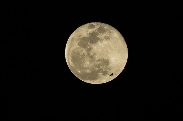 — — - FDX401, MD11, eastbound from LAX to MEM, on March 23, 2016,  the night of the full moon.  Near 8:35PM, taken in Huntington Beach, CA