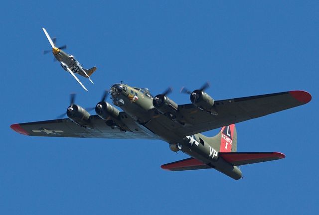 Boeing B-17 Flying Fortress (N7227C) - B-17G Flying Fortress "Texas Raiders" being escorted by little friend "Charlotte's Chariot II" a P-51D at the 2018 Commemorative Air Force Wings Over Dallas airshow (Please view in "full" for highest image quality)