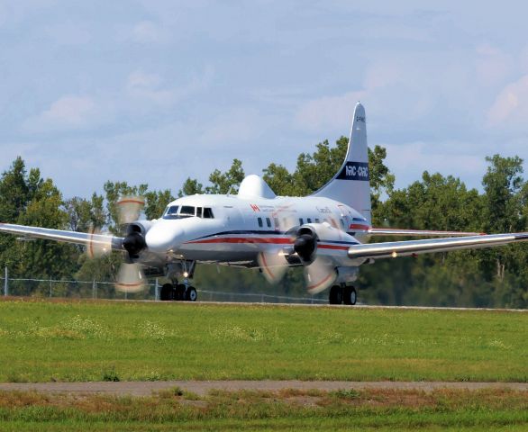 CONVAIR CV-580 (C-FNRC) - Leaving rwy 25 for a series of touch and goes.