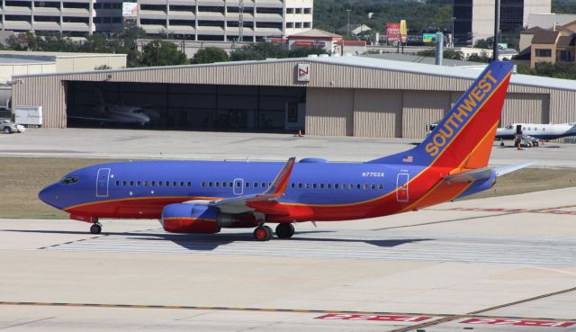 Boeing 737-700 (N7702A) - Departing on Runway 4.