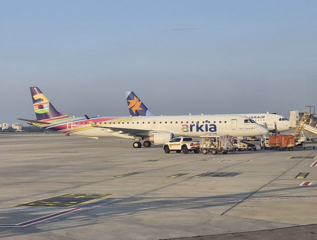 EMBRAER 195 (4X-EMF) - 4X-EMF (Arkia) and 4X-ABS(Israir) awaiting their departure to Ramon-Eilat on a late afternoon.