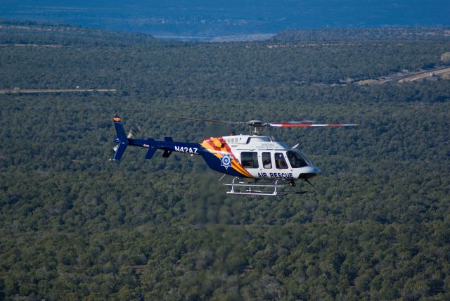 Bell 407 (N42AZ) - This shot I happened to luck into.  My wife, daughter, and I were on our way to California for vacation when we stopped at this rest area to take a few pictures at the scenic overlook.  When we pulled in, there were numerous sheriffs vehicles and this helicopter flying around.  Turns out someone had gotten lost while out hiking and they were in the process of trying to find him.