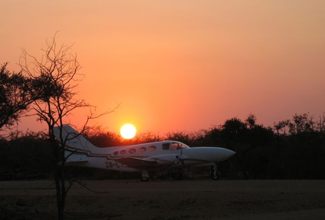 Cessna Chancellor (ZS-LTY) - Sunset at a bush strip in South Africa.