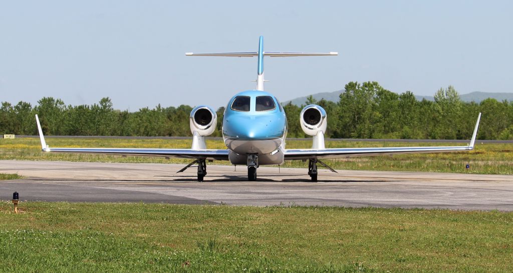 Honda HondaJet (N143RP) - Koury Aviation's 2019 model HondaJet Elite turning onto the ramp after arriving at Boswell Field, Talladega Municipal Airport, AL during the GEICO 500 Race Weekend - April 22, 2023.