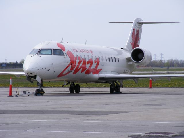 Canadair Regional Jet CRJ-200 (C-FWRS) - parked on military ramp until needed.