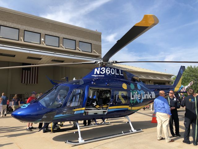 Piper Cheyenne 400 (N360LL) - Standing on the helicopter Pad at Marshfield Clinic Health System sits the new Life Link iii Augusta Westland AW119MKII