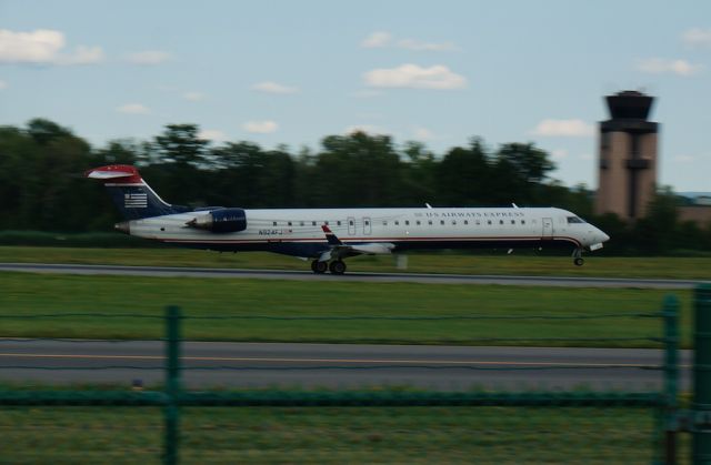 Canadair Regional Jet CRJ-900 (N924FJ) - A CRJ-900 operated by Mesa Airlines kisses runway 19 as it arrives from Charlotte, North Carolina. 