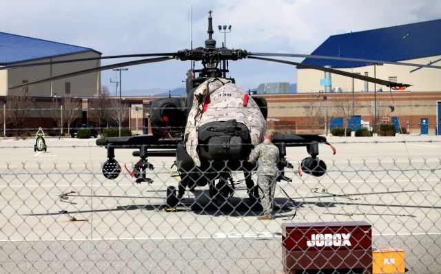 ARMY — - Flight preperations take place of an Apache Attack Helicopter At KBOI