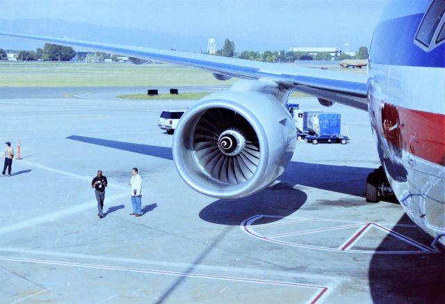 Boeing 777-200 (N775AN) - KSJC - Inaugural American Airlines 777-200 service San Jose, CA USA to Tokyo-Narita, (SJC-NRT) Japan on May 1, 1999. I was able to get Aircraft and ramp access for photos and videos of the departure with the help of a co-worker. This jet was less than 1-month old, and a side note I saw this jet at Boeing Everett in April 1999 undergoing flight test and also parked on the hard stand - just by chance when up visiting my Father and other relatives that year. Special thanks to Craig Curtis for the help with Ramp access and jet tour. Once the Pilots were ready to board, the very friendly flight crew directed us to the lobby for the Inaugural festivities - complete with Dragon and drums, and nice young local talent dancing and making the Inaugural send off a great success. I videotaped all of that - one of these days I'll post to my youtube page, along with the take off from the taxiway. Below, media and AA promotion people are getting ready for us to come back on the ramp to let the few local photogs and San Jose News medias for a van ride to the edge of the taxiway for take off.