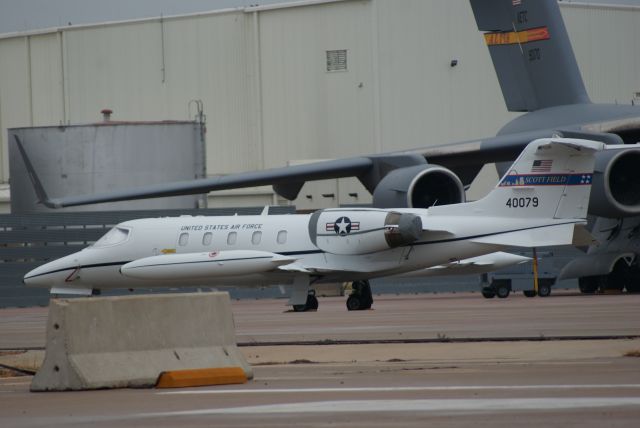 Learjet 35 (84-0079) - I snapped a quick photo of a C-21A sitting on the ramp at Altus AFB, OK. Chief Master Sergeant of the Air Force Bass was visiting. Behind it, you can see an Altus C-17A.