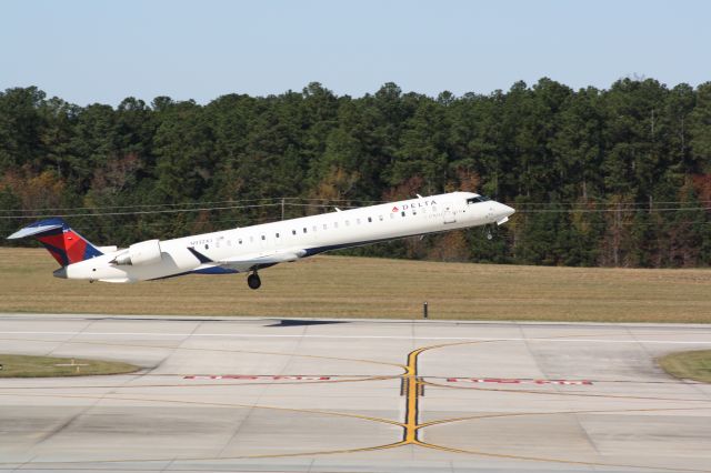 Canadair Regional Jet CRJ-900 (N932XJ) - N932XJ leaving ground effect off of runway 5L