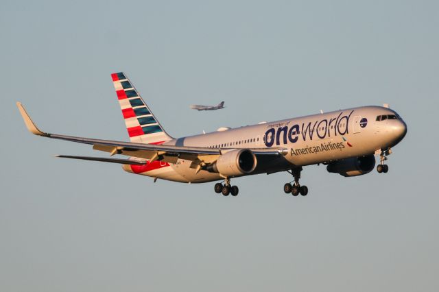 BOEING 767-300 (N343AN) - AAL734 arrives from PHL in the early morning with Virgin's G-VROM in the background.