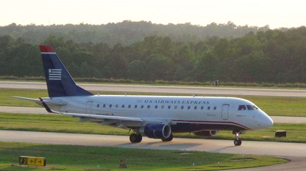 Embraer 170/175 (N814MD) - U.S. Airways (Republic) 3519 departing to Philadelphia at 7:56 P.M. with some great evening lighting.   Taken June 7, 2015.   