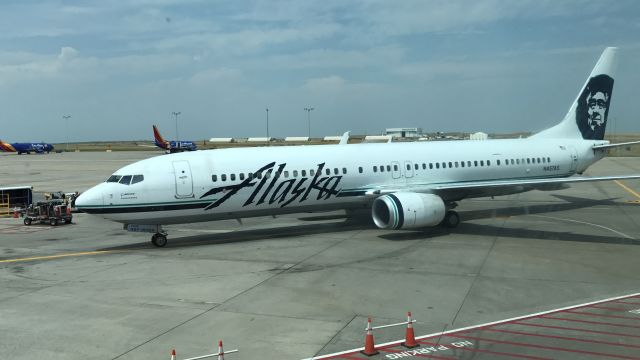 Boeing 737-900 (N457AS) - Alaska pulling into the gate in Denver, my view while having a beer :)