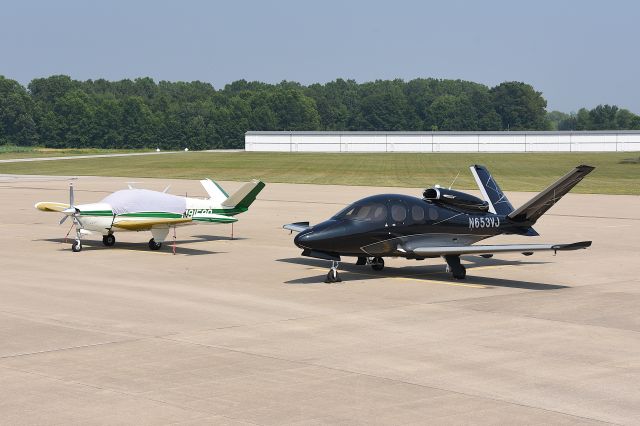 Cirrus Vision SF50 (N653VJ) - 07-14-25 along with BE35 N9158Q. Dos twin V-tails parked adjacent to each other.