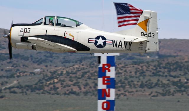 North American Trojan (N372C) - N372C, a 1955 North American T-28B owned by the Palm Springs Air Museum, is caught here as it takes off for a practice flight around the race course route during the 2019 Pylon Racing Seminar being held now at Reno Stead Airport (KRTS) in preparation for the 2019 National Championship Air Races.