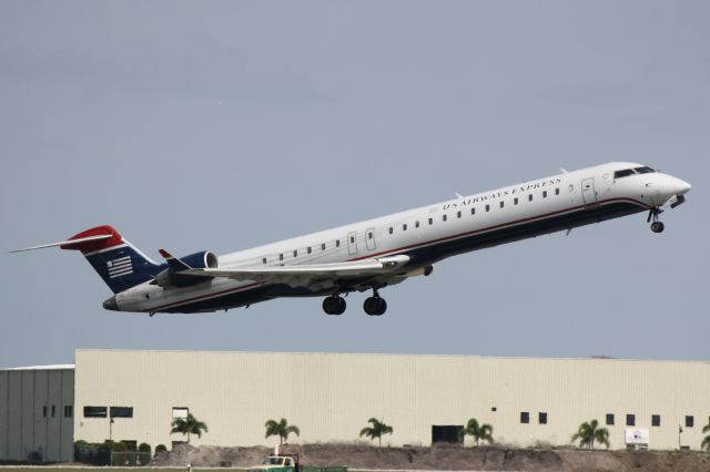 Canadair Regional Jet CRJ-900 (N922FJ) - Mesa/US Air Flight 2647 (N922FJ) departs Runway 14 at Sarasota-Bradenton International Airport enroute to Charlotte/Douglas International Airport