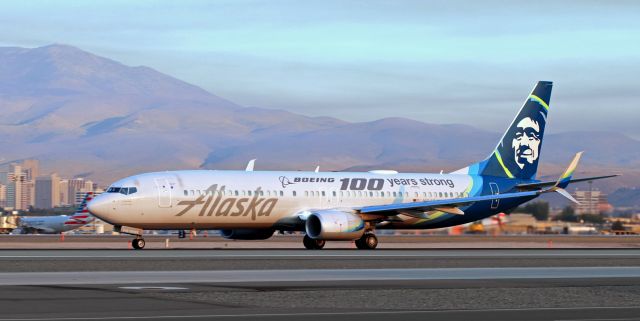 Boeing 737-900 (N248AK) - Caught here in "golden hour" (7:15 AM) morning light that is being diffused and made rather murky by a blanket of low level wildfire smoke hanging over the airport and the city; Alaska's N248AK, dressed in the "Boeing 100 Years Strong" special livery, accelerates down 16L to begin a new revenue day with a RNO-SEA trip.