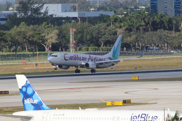 Boeing 737-800 (9Y-BGI) - Caribbean Airlines (BW) 9Y-BGI B737-8Q8 [cn28232]br /Fort Lauderdale (FLL). Caribbean Airlines flight BW31 touches down on Runway 09R on arrival from Kingston Norman Manley (KIN).br /Taken from Terminal 1 car park roof level br /2018 04 07br /a rel=nofollow href=http://alphayankee.smugmug.com/Airlines-and-Airliners-Portfolio/Airlines/AmericasAirlines/Caribbean-Airlines-BW/https://alphayankee.smugmug.com/Airlines-and-Airliners-Portfolio/Airlines/AmericasAirlines/Caribbean-Airlines-BW//a