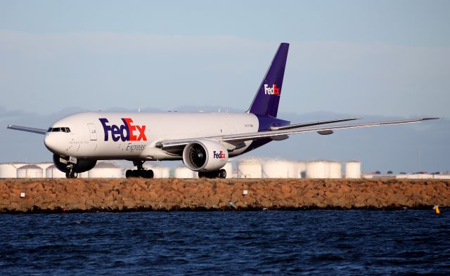 BOEING 777-200LR (N891FD) - Turning on to Taxiway Alpha