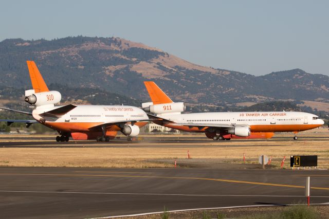 McDonnell Douglas DC-10 (N17085) - Tanker 911 taxiing out for departure while Tanker 910 waits to taxi in to reload for the Lake Fire.