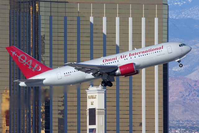 BOEING 767-200 (N225AX) - Omni Air International N225AX (FLT OAE106) climbing out from RWY 1R en route to Honolulu Intl (PHNL).  [KLAS - 12-22-2011]