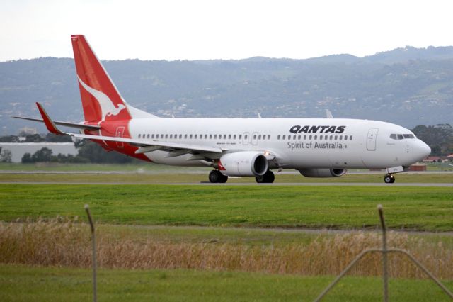 Boeing 737-800 (VH-VYL) - On taxiway heading for take-off on runway 05. Thursday, 19 June 2014.