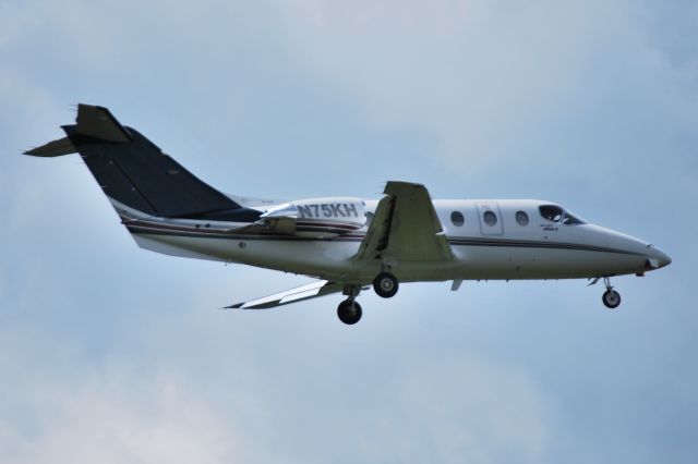 Beechcraft Beechjet (N75KH) - 75 EXPRESS INC (NASCAR Nationwide Series driver Kenny Habul) on final at KSVH - 8/19/14