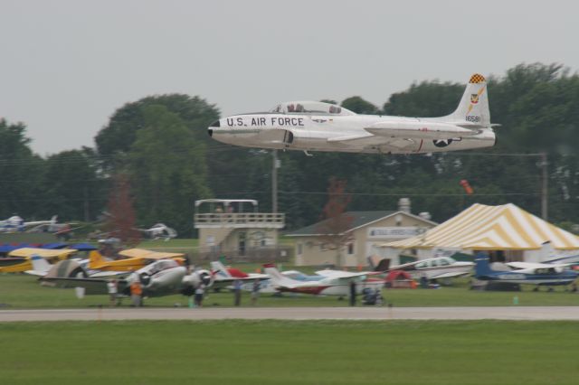 — — - T-33 Departs Runway 18 Oshkosh Friday Airshow 2010