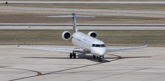 Canadair Regional Jet CRJ-700 (N796SK) - Taxiing to gate after arrival on 12R from ORD.