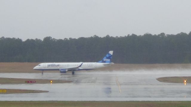 Mooney M-20 (N233JB) - "Blissfully Blue" taxis out to runway 23R.  Taken March 19, 2015.