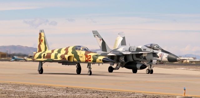 76-1536 — - A pair of aggressors (761536, an F-5N Tiger of the VFC-13 "Fighting Saints", NAS Fallon, Nevada; and 162846, an F/A-18+ Hornet of the VFC-12 "Fighting Omars," NAS Oceana, Virginia) roll east on taxiway Foxtrot as they prepare to take off on KNFLs runway 13L.