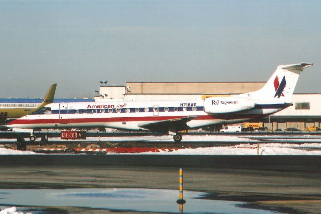 Embraer ERJ-135 (N718AE) - Taxiing to Terminal 8 in Feb-06.br /br /With American Eagle from Jun-00 to Jul-16 when it became N254JX for JetSuiteX.