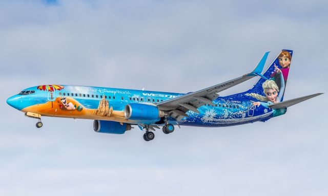 Boeing 737-800 (C-GWSV) - Westjets Frozen livery on short finals for runway 24L