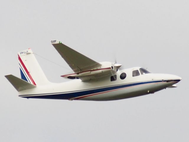 Aero Commander 500 (VH-UJX) - Lifting off on a dull, grey afternoon from runway 23, Adelaide International. photo taken from the Tapleys Hill Road viewing area.