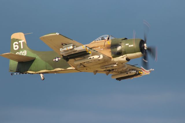 Douglas AD Skyraider (N2AD) - Skyraider on the take-off with authority during Wednesday AirVenture Warbird Show. br /br /Lots of points for ordnance on those wings !!