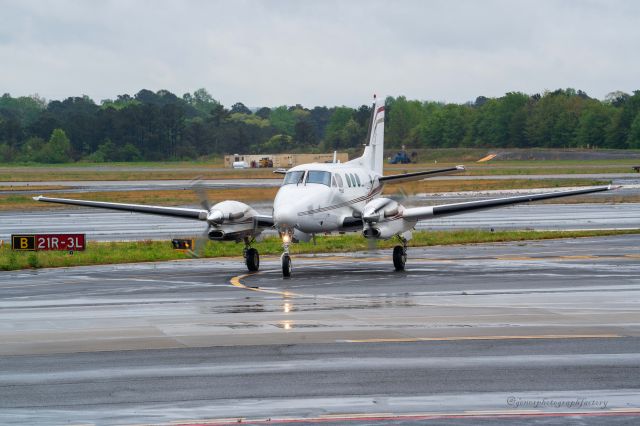 N377P — - Arriving on a wet evening at PDK>