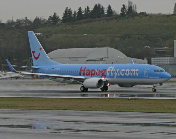 Boeing 737-800 (D-ATUG) - At a rain soaked Boeing Field.