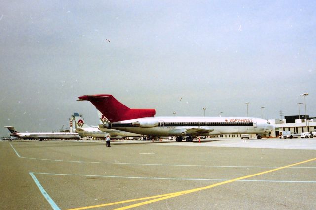BOEING 727-200 (N276US) - KSJC - mid 1990 at San Jose - a lady I worked with husband worked for the City of San Jose Engineering team. I found out they were doing runway work so I let him use my 35mm loaded with a roll of 36 ASA 100 out in between the runways. I received the camera and film back a few days later and got some interesting photos. I gave him $20 and he was shocked!.