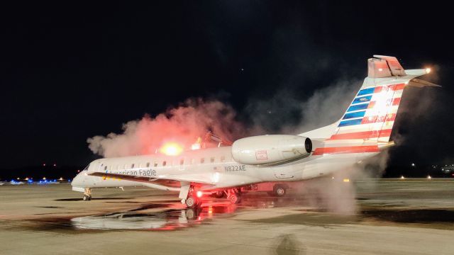 N822AE — - Aircraft 822 getting deiced for the 6 AM AA3431 from Manhattan to Dallas. With the hot deice fluid and beacon light, she almost looks like she's on fire!