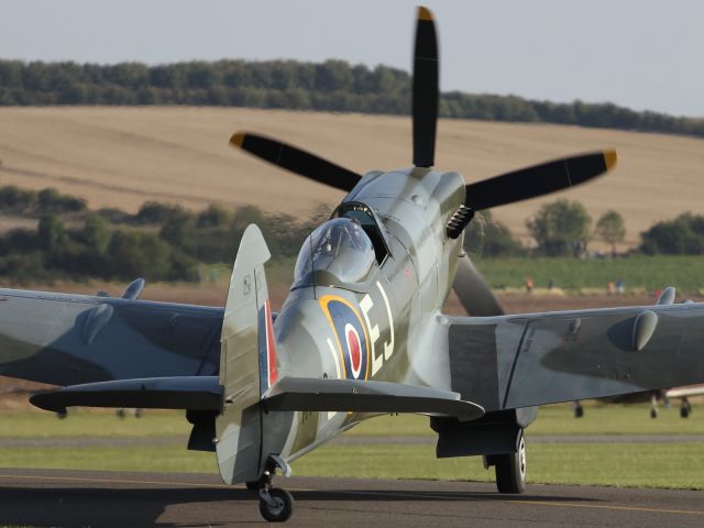 — — - A Supermarine Spitfire about to taxi into position for take off at Duxford Air Museum.