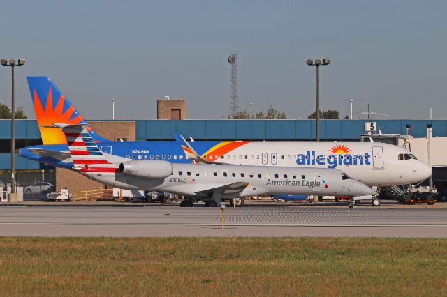 Embraer ERJ-145 (N900AE) - American Eagle/Envoy (ENY3562), N900AE, EMB-145LR, c/n 14500885, taxies by a recently delivered Allegiant Airbus (N249NV) being boarded at the terminal at Toledo Express Airport (KTOL), OH, USA on 18 Oct 2017.