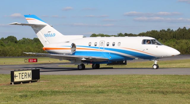 Hawker 800 (N99AP) - A 1999 model Raytheon Hawker 800XP taxiing at Boswell Field, Talladega Municipal Airport, AL, after the NASCAR GEICO 500 race at Talladega Super Speedway - late afternoon, April 25, 2021. 