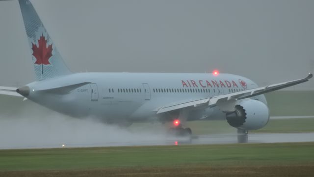 Boeing 787-8 (C-GHPT) - Taking off to Toronto from a very wet Rwy 24R.