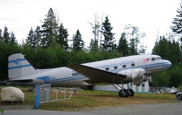 Douglas DC-3 (N877MG) - The aircraft is being worked on at Sealand in Campbell River.  Tail Number was N877MG before renovations started