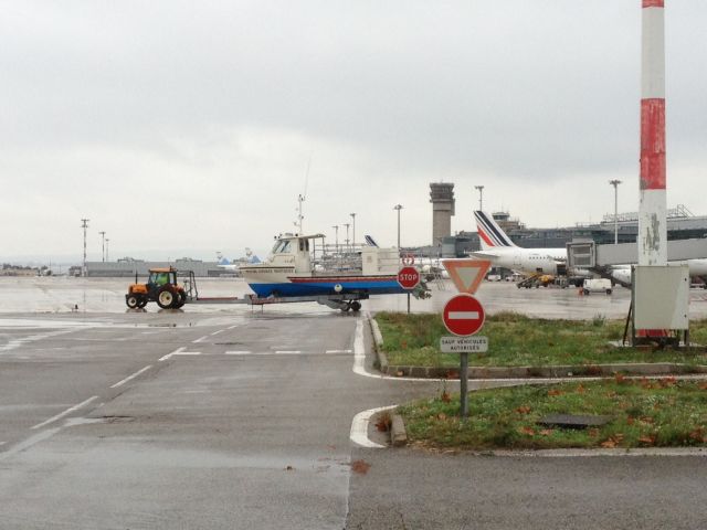 — — - Marseille airport, main apron: Safety boat dedicated for seaplane Canadair CL415 scooping and landing on the "vaine" pond located northwest of the runway. This boat often  cross the airport! strange view.