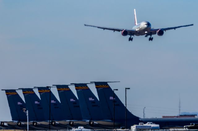 Boeing 777-200 (N828AX) - An Omni Air International 777-200 landing at PHX on 2/10/23 during the Super Bowl rush. Taken with a Canon R7 and Canon EF 100-400 II L lens.