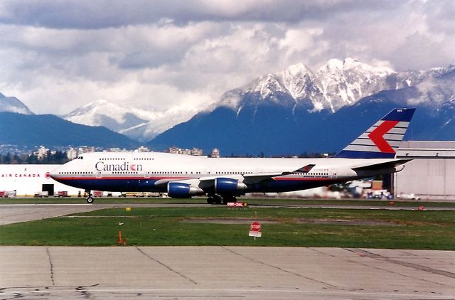 Boeing 747-400 (C-FGHZ) - C-YVR Canadien 747 departing Vancouver for the Orient, this photo taken April 1999.There was fresh snow in the Coast range of the Rockies in the background.